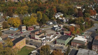 DX0002_216_022 - 5.7K aerial stock footage descend with view of buildings around a small town intersection in Fort Edward, New York