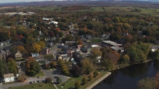 DX0002_216_024 - 5.7K aerial stock footage approach and orbit buildings around a small town intersection in Fort Edward, New York