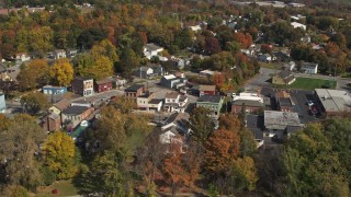DX0002_216_025 - 5.7K aerial stock footage of circling buildings around a small town intersection in Fort Edward, New York