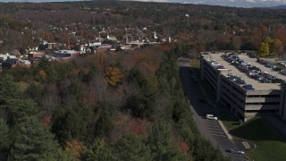 DX0002_218_010 - 5.7K aerial stock footage of downtown seen from a parking garage on a hill, Montpelier, Vermont