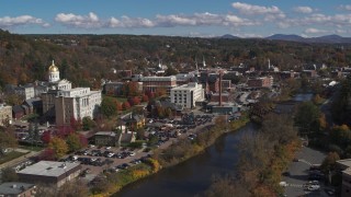 DX0002_218_020 - 5.7K aerial stock footage fly away from government offices and smoke stack by capitol and the river, Montpelier, Vermont