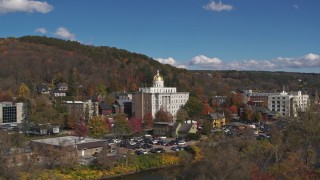 DX0002_218_026 - 5.7K aerial stock footage focus on government office building, seen from the river, Montpelier, Vermont