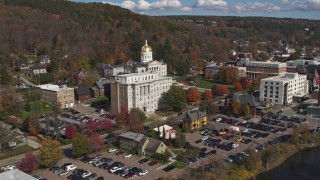DX0002_218_027 - 5.7K aerial stock footage focus on government office building and capitol, descend by the river, Montpelier, Vermont