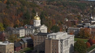 DX0002_218_037 - 5.7K aerial stock footage of the state capitol dome behind a government office building, Montpelier, Vermont