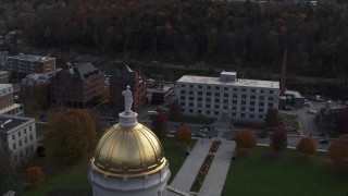 DX0002_219_010 - 5.7K aerial stock footage of orbiting a government office building seen from the capitol in Montpelier, Vermont