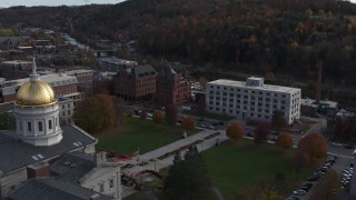 DX0002_219_011 - 5.7K aerial stock footage of flying away from government office building and the capitol in Montpelier, Vermont