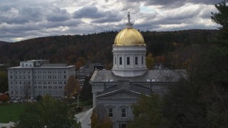 DX0002_219_020 - 5.7K aerial stock footage descend while focused on the capitol dome, Montpelier, Vermont