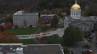 DX0002_219_028 - 5.7K aerial stock footage of flying away from people walking up the front steps of the capitol building, Montpelier, Vermont