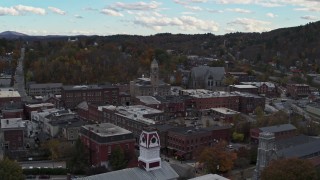DX0002_219_033 - 5.7K aerial stock footage of a wide orbit of city hall and downtown buildings before descent, Montpelier, Vermont