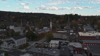 DX0002_219_037 - 5.7K aerial stock footage of ascending away from church steeples and downtown buildings, Montpelier, Vermont