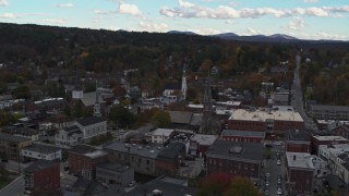 DX0002_219_038 - 5.7K aerial stock footage of orbiting church steeples and downtown buildings, Montpelier, Vermont