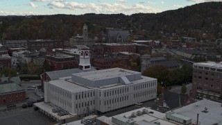 DX0002_219_045 - 5.7K aerial stock footage descend near the US Postal Service building in downtown, Montpelier, Vermont