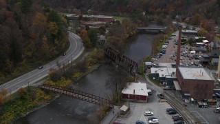 DX0002_219_056 - 5.7K aerial stock footage approach, orbit, and fly away from bridges spanning the Winooski River, Montpelier, Vermont