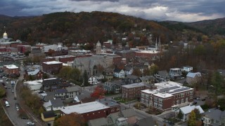 DX0002_220_005 - 5.7K aerial stock footage of flying away from city hall at sunset, Montpelier, Vermont