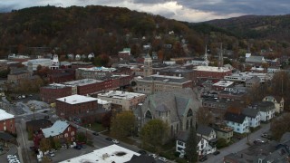 DX0002_220_012 - 5.7K aerial stock footage approach and orbit city hall and brick buildings at sunset, Montpelier, Vermont