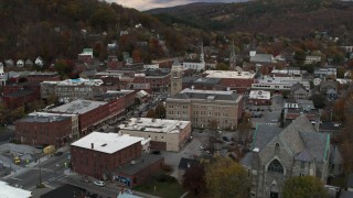 DX0002_220_013 - 5.7K aerial stock footage of a stationary view of city hall and brick buildings at sunset, Montpelier, Vermont
