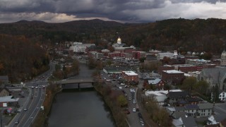 DX0002_220_022 - 5.7K aerial stock footage of the state capitol at sunset while following the river, Montpelier, Vermont