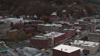 DX0002_220_030 - 5.7K aerial stock footage of Union Block buildings near city hall at sunset, Montpelier, Vermont