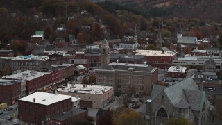DX0002_220_032 - 5.7K aerial stock footage of flying by city hall at sunset, reveal church, Montpelier, Vermont