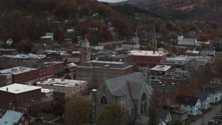 DX0002_220_033 - 5.7K aerial stock footage of passing by a church and city hall at sunset, Montpelier, Vermont