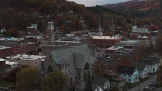 DX0002_220_034 - 5.7K aerial stock footage of descend and flyby church and city hall at sunset, Montpelier, Vermont