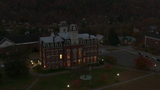 DX0002_220_046 - 5.7K aerial stock footage of circling the Vermont College of Fine Arts at twilight, Montpelier, Vermont