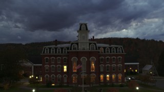 DX0002_220_049 - 5.7K aerial stock footage focus on the Vermont College of Fine Arts while ascending at twilight, Montpelier, Vermont