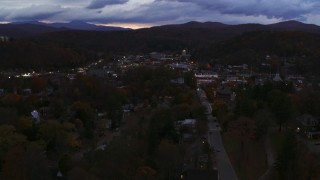 DX0002_220_055 - 5.7K aerial stock footage of the downtown area of the city seen while passing State Street at twilight, Montpelier, Vermont