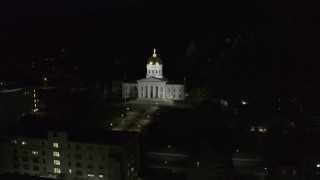 DX0002_221_005 - 5.7K aerial stock footage of orbiting the front of the Vermont State Capitol at night, Montpelier, Vermont