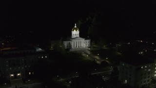 DX0002_221_006 - 5.7K aerial stock footage of circling the front of the Vermont State Capitol at night, Montpelier, Vermont