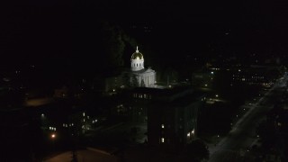 DX0002_221_007 - 5.7K aerial stock footage of approaching and orbiting the front of the Vermont State Capitol at night, Montpelier, Vermont