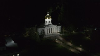 DX0002_221_008 - 5.7K aerial stock footage of closely orbiting the front of the Vermont State Capitol at night, Montpelier, Vermont