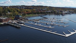 DX0002_222_014 - 5.7K aerial stock footage fly away from and orbit a marina on Lake Champlain, Burlington, Vermont