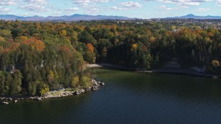 DX0002_223_005 - 5.7K aerial stock footage of orbiting a small cove in Lake Champlain, Burlington, Vermont