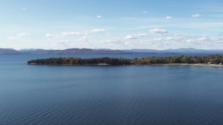 DX0002_223_012 - 5.7K aerial stock footage of flying by a few waterfront homes on Appletree Point by Lake Champlain, Burlington, Vermont