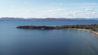 DX0002_223_015 - 5.7K aerial stock footage of flying by lakefront homes on Appletree Point by Lake Champlain, Burlington, Vermont