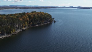 DX0002_223_023 - 5.7K aerial stock footage of forest on the tip of Lone Rock Point by Lake Champlain, Burlington, Vermont