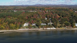 DX0002_223_026 - 5.7K aerial stock footage orbit four beachfront homes on the shore of Lake Champlain, Burlington, Vermont