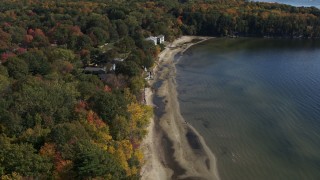 DX0002_223_031 - 5.7K aerial stock footage descend by beachfront homes by the shore of Lake Champlain, Burlington, Vermont