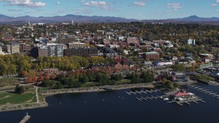 DX0002_224_005 - 5.7K aerial stock footage orbit downtown buildings, park and marina, Burlington, Vermont