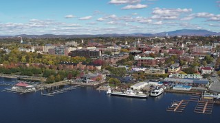 DX0002_224_011 - 5.7K stock footage aerial video reverse view of downtown buildings and marinas, Burlington, Vermont
