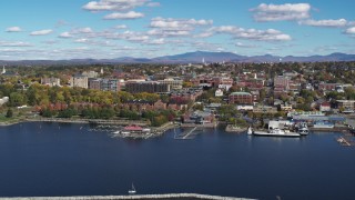 DX0002_224_012 - 5.7K aerial stock footage wide orbit of downtown buildings, seen from breakwaters, Burlington, Vermont