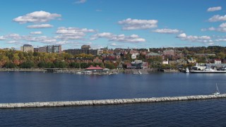 DX0002_224_015 - 5.7K aerial stock footage fly low over breakwaters toward downtown, Burlington, Vermont