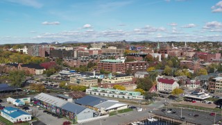 DX0002_224_022 - 5.7K aerial stock footage of circling buildings in downtown, reveal the marina, Burlington, Vermont
