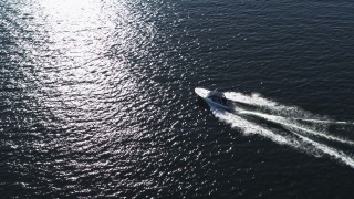 DX0002_224_025 - 5.7K aerial stock footage of tracking a speedboat racing across Lake Champlain near Burlington, Vermont