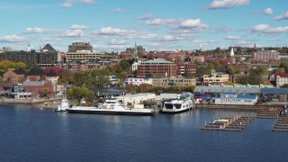 DX0002_224_033 - 5.7K aerial stock footage orbit office building in downtown, seen from marina, Burlington, Vermont