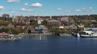 DX0002_224_034 - 5.7K aerial stock footage orbit office building in downtown, seen from a marina, Burlington, Vermont