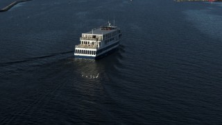 DX0002_224_044 - 5.7K aerial stock footage descend and orbit a ferry on Lake Champlain, Burlington, Vermont
