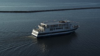 DX0002_224_047 - 5.7K stock footage aerial video circling around a ferry on Lake Champlain, Burlington, Vermont