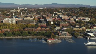 DX0002_224_049 - 5.7K stock footage aerial video of a wide orbit of city building near a marina in downtown, Burlington, Vermont